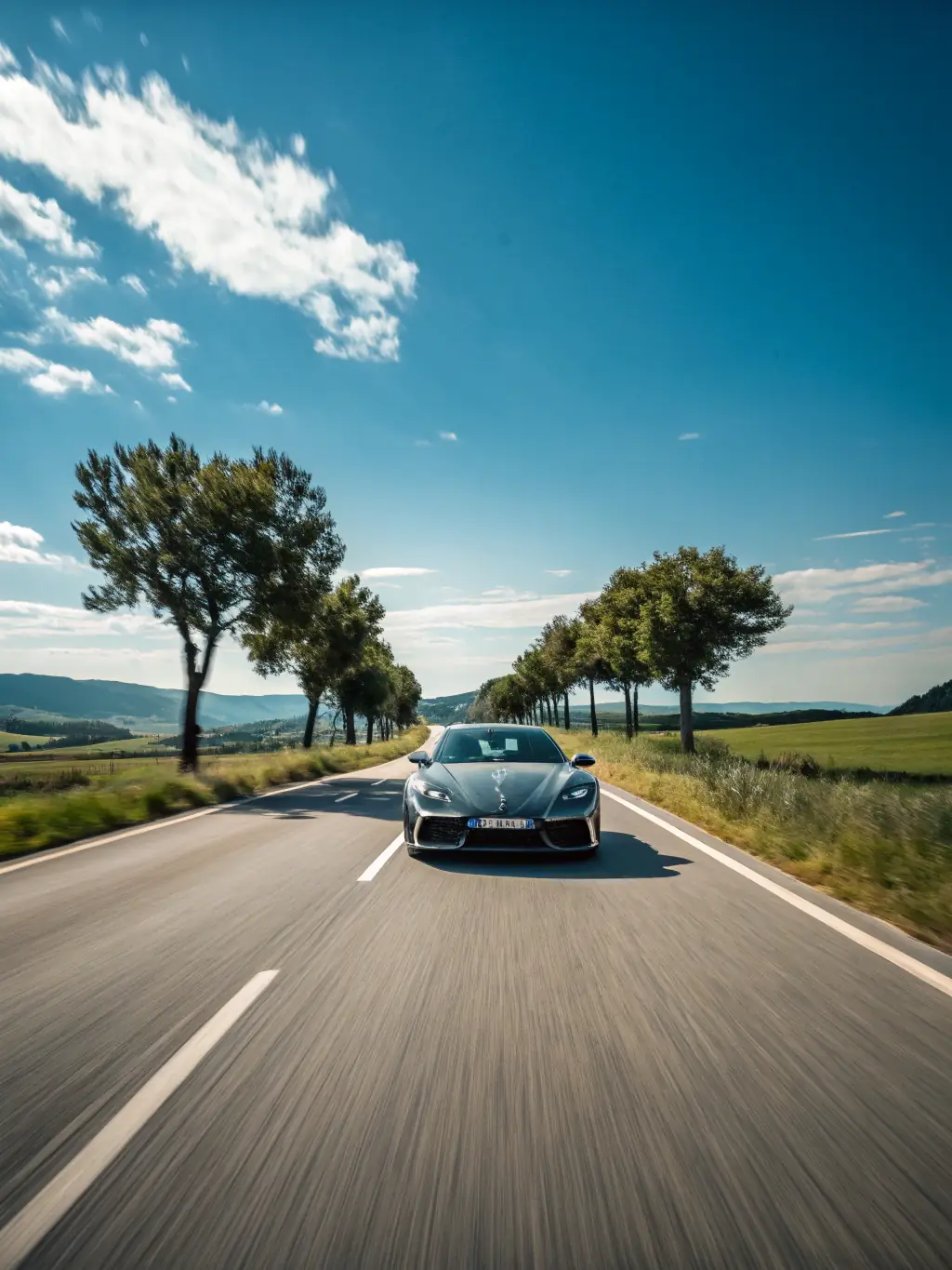 A car driving on a highway during a sunny day, showcasing advanced driving skills and techniques.
